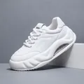 Professional studio shot of white chunky men's platform sneakers with air cushion - 41 / White