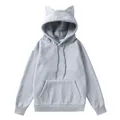 Vista detallada de sudadera de forro polar gris para mujer con diseño orejas de gato. - S / Tops / Gris claro