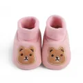 Close-up detail of pink soft sole baby shoes featuring an embroidered cartoon bear - 11cm / Pink