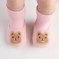 Detailed view of pink knitted baby shoes featuring a cute embroidered brown bear character - 11cm / Cartoon Bear Style (6127) / Pink