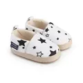 Zapatos de lona blanca para bebé con estampado de estrellas y suela trenzada - Negro