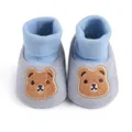 Close-up view of baby soft sole shoes featuring a cute embroidered brown bear design - 11cm / Blue