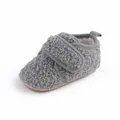 Detailed side view of grey plush baby winter walking shoes with adjustable velcro strap - Gray
