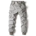 Men's grey cargo pants with elastic waist and drawstring features multi-pockets design. - 29 / Bottoms / Light Gray
