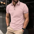 Detailed view of men's pink short-sleeve polo shirt with black trim on collar and cuffs - S / Tops / Pink