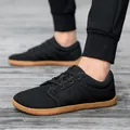 Atmungsaktive schwarze Mesh-Barfußschuhe mit breiter Zehenbox und rutschfester Gummisohle - 36 / Schwarz