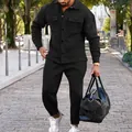 Full body view of a man wearing a stylish black suede jacket and matching pants set. - S / Top And Bottom / Black