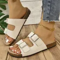 Stylish women's cream double-strap slide sandals with cork footbed for beach vacations - White