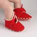 Close-up of red fleece-lined baby winter pre-walker boots with non-slip sole - Red
