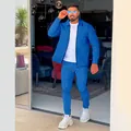 Men's bright blue waffle knit tracksuit set with zipper cardigan and matching pants. - Blue