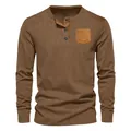 Front view of a brown men's long-sleeved corduroy Henley shirt with a contrast pocket - Brown
