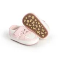 Pink and white baby walker shoes featuring a non-slip rubber sole with cute footprint patterns - Pink