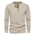 Front view of men's beige corduroy Henley long sleeve T-shirt with button collar detail - Apricot