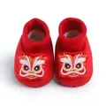 Close-up of festive red baby walking shoes with traditional lion dance embroidery details - Inner Length 11cm / Lion Dance