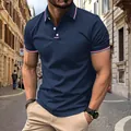 Detail view of navy blue men's polo shirt with red and white striped collar and cuffs - Navy Blue