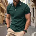 Detail view of dark green men's polo shirt with striped collar and cuff accents - Dark Green