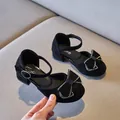 Elegant black girls pumps featuring rhinestone-studded bows and secure ankle straps - 27 / Black