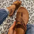 Retro brown leather toe-loop flat sandals for women featuring stylish buckle detail - 35 / Brown