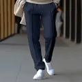 Close-up of navy blue men's casual straight-leg trousers with center crease detail - M / Bottoms / Navy Blue