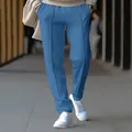 Detailed view of men's blue straight-leg casual trousers with vertical seams - Denim Blue