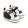 Close-up of black and white baby pre-walker shoes with magic prewalker velcro strap - 11cm / Black