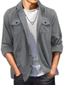 Macro view of men's premium gray faux suede lapel jacket featuring classic chest pockets. - Gray