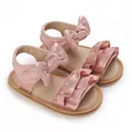 Shimmering pink baby sandals with bow and ruffle details for summer beach walks - Sole Length 11 cm / 70 g / Pink