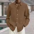 Close-up of a men's brown ribbed long-sleeve casual shirt featuring white buttons. - S / Tops / Dark Brown