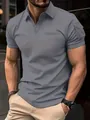 Detailopname van een grijs herenpoloshirt met een unieke zak op de korte mouw - S / Tops / Grijs