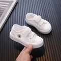Breathable white mesh sneakers for toddlers featuring an adjustable velcro strap closure - White