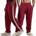 Front and side view of men's loose burgundy joggers with white side stripes - S / Bottoms / Burgundy