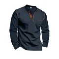 Close-up of navy blue long sleeve Henley shirt featuring stylish brown color-block trim. - S / Tops / Navy Blue