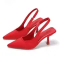 Elegant red pointed-toe slingback pumps featuring a sleek kitten heel and satin-like finish. - 35 / Red