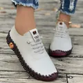 Close-up view of white handmade casual loafers for women with a soft and flexible sole - Off White