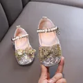 Elegant sparkling silver girls princess shoes featuring gold bow and delicate pearl strap - Gold