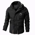 Black men's outdoor windbreaker jacket with detachable hood and mountain patch emblem - M / Tops / Black