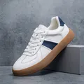 Premium white leather men's GAT casual sneakers featuring navy blue stripe and gum sole - 39 / White Blue