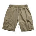 Detailed macro view of men's khaki slub linen cargo shorts featuring drawstring waistband - Earthy Yellow
