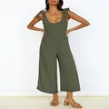 Detail view of olive green wide-leg jumpsuit with tie-shoulder straps and patch pockets - Army Green