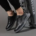 Stylish black leather sneakers for men with gray striped details and a thick sole. - 38 / Black