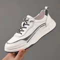 Premium white leather casual sneaker for men featuring grey accents and fashion lettering - 38 / White