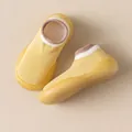 Bright yellow knit baby walking sock shoes featuring soft non-slip flexible rubber soles - Turmeric