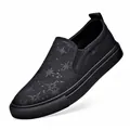 Men's breathable mesh slip-on loafers featuring a stylish black star pattern print - Size 38 / Black