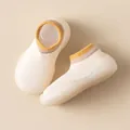 Soft-soled breathable baby sock shoes in cream with a yellow striped ankle collar - Beige