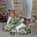 Detailed view of colorful graffiti print sneakers featuring thick white soles and laces - 36 / Green