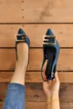 Elegant dark blue pointed-toe slingback sandals featuring a large gold buckle - Blue