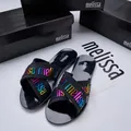 Melissa black jelly slide sandals with colorful iridescent logo cross straps for women. - Black