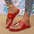 Close-up of stylish red flat sandals with gold metal buckle decoration for women - 38 / Red