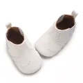 Detailed overhead view of white soft-soled baby walking shoes with elegant brogue pattern. - Inner Length 11cm / White