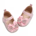 Detailed close-up of pink patent leather baby girl shoes with a rhinestone bow decor - Insole Length 11cm / Pink